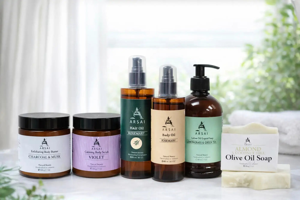 The image displays a collection of arsai brand skincare and haircare products, including body butter, scrubs, oils, liquid soaps, and an olive oil soap bar.